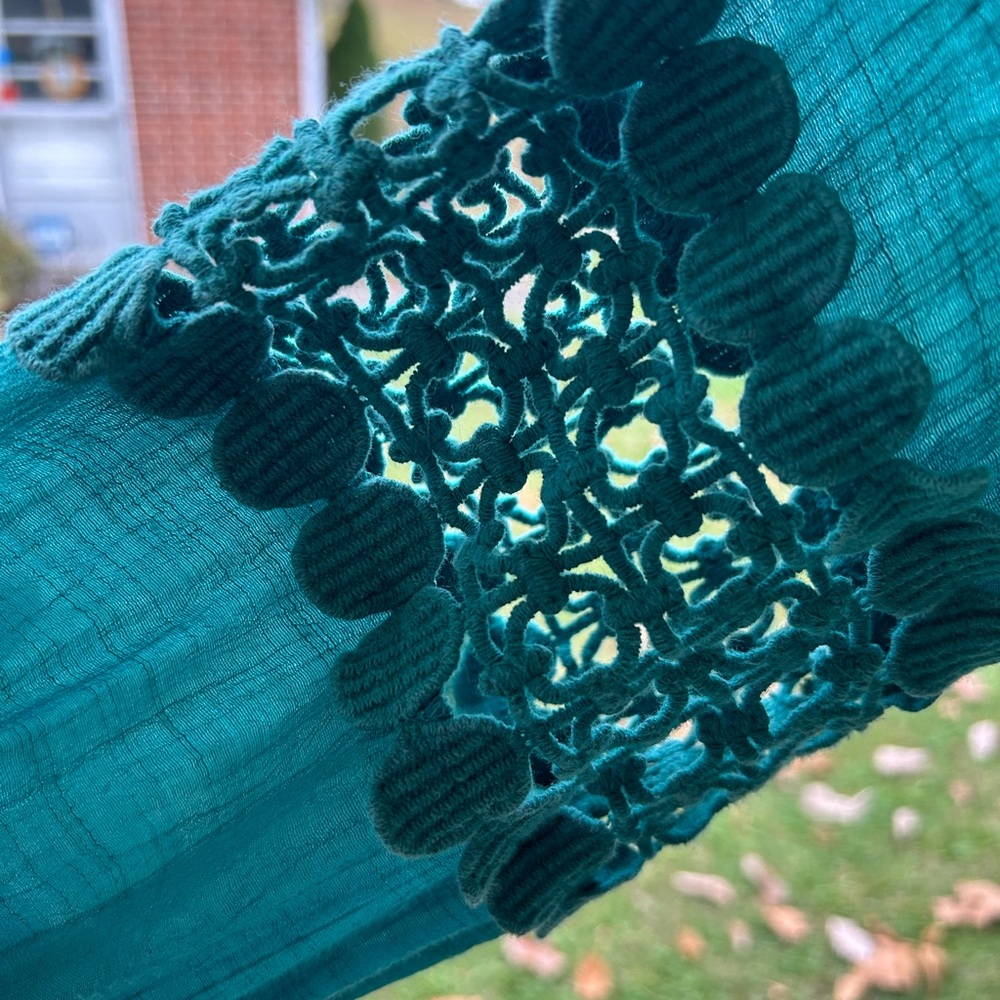 Pre-worn, pre-loved indigo soul green bohemian style top w/ shark bite style hem